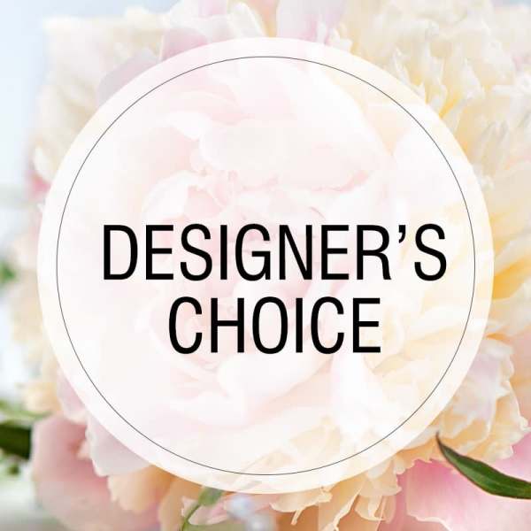 Soft pink and cream flowers behind a circular "Designer’s Choice" label
