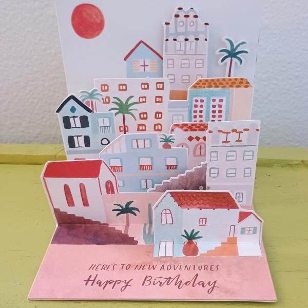 Pop-up birthday card with colorful houses and palm trees
