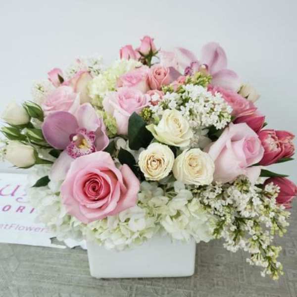 Pink and white rose bouquet in a white box