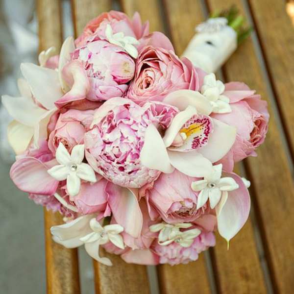 Pink and white bridal bouquet with roses and orchids