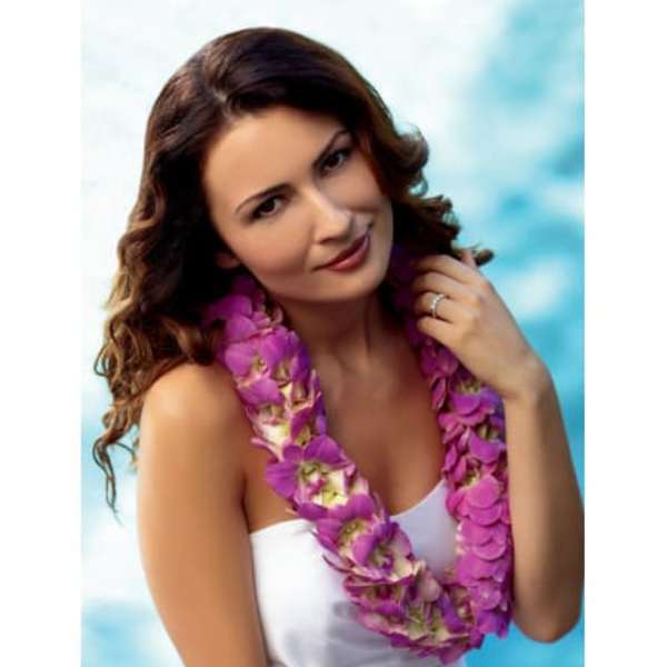 Woman wearing a purple flower lei over a white dress