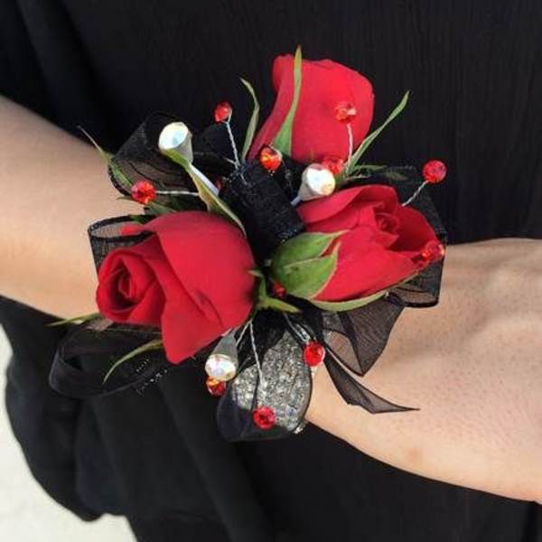 Red rose wrist corsage with black ribbon and bead accents