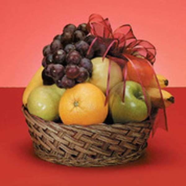 Basket of assorted fruit with a red ribbon