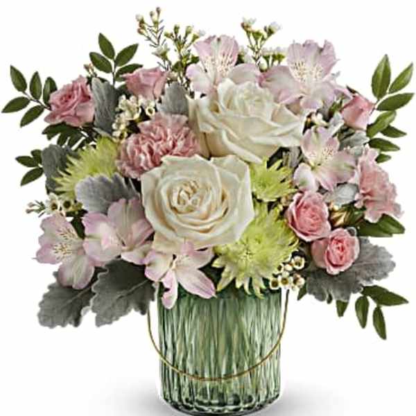 Pink and white floral arrangement in a glass vase