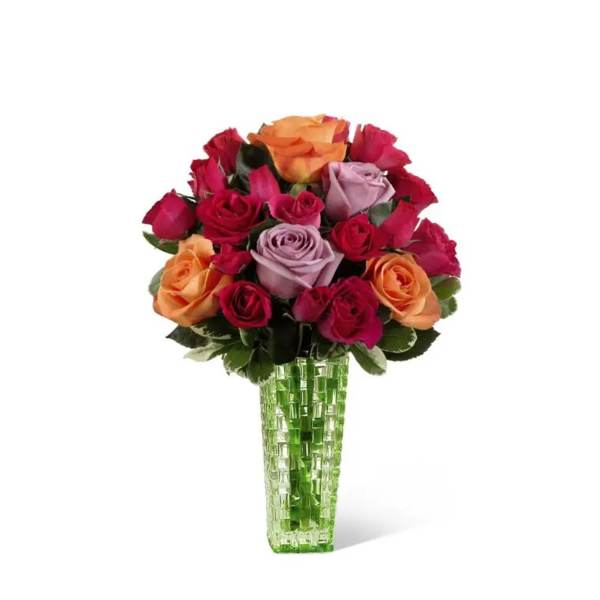 Bouquet of multicolored roses in a green glass vase