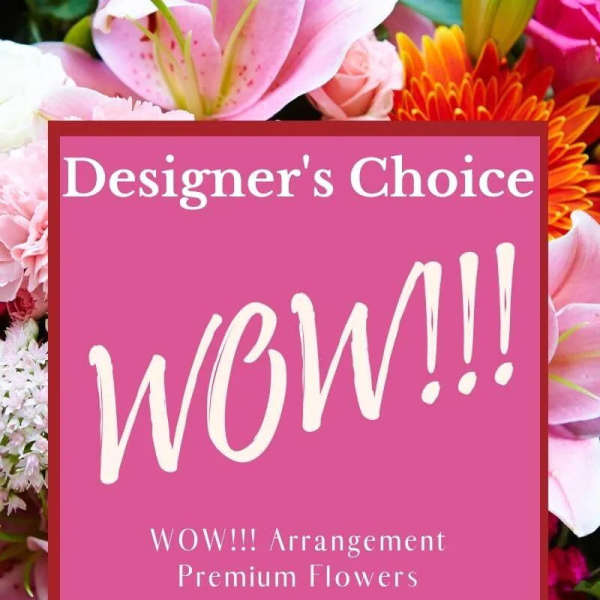 Designer’s choice flower arrangement with pink, white, and orange blooms