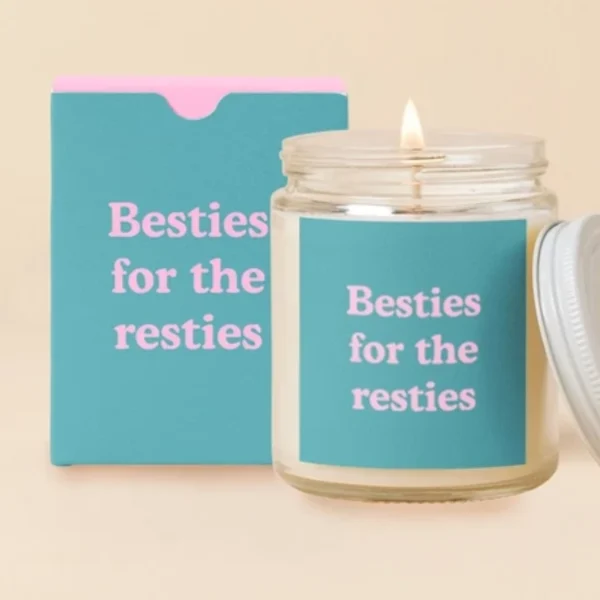 Lit candle in a glass jar with a matching box and lid