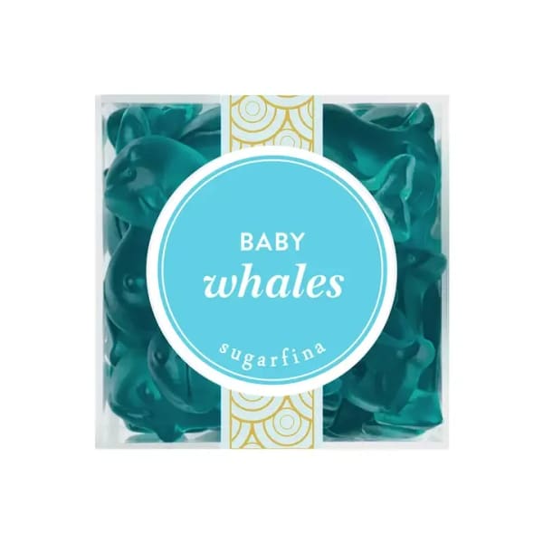 Box of teal baby whale gummies with a round label