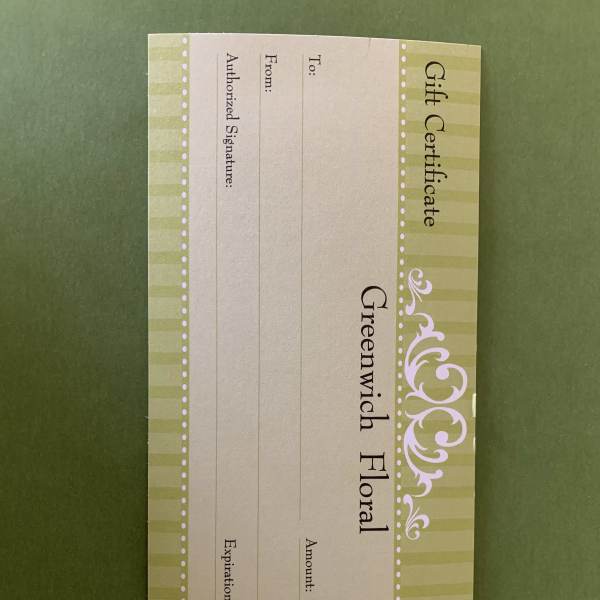 Greenwich Floral gift certificate card on a green background