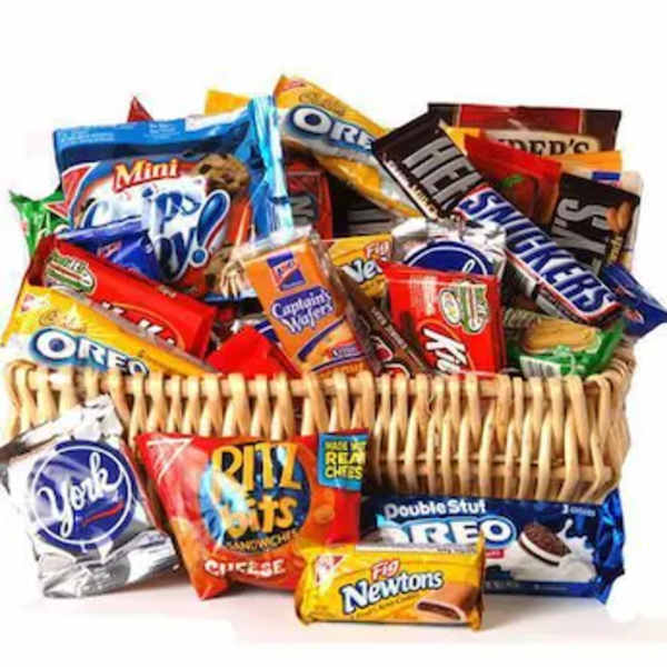 Basket filled with assorted snack-size candy and cookie packages