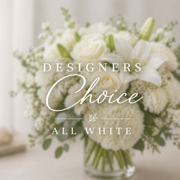 White bouquet with lilies and round blooms in a glass vase