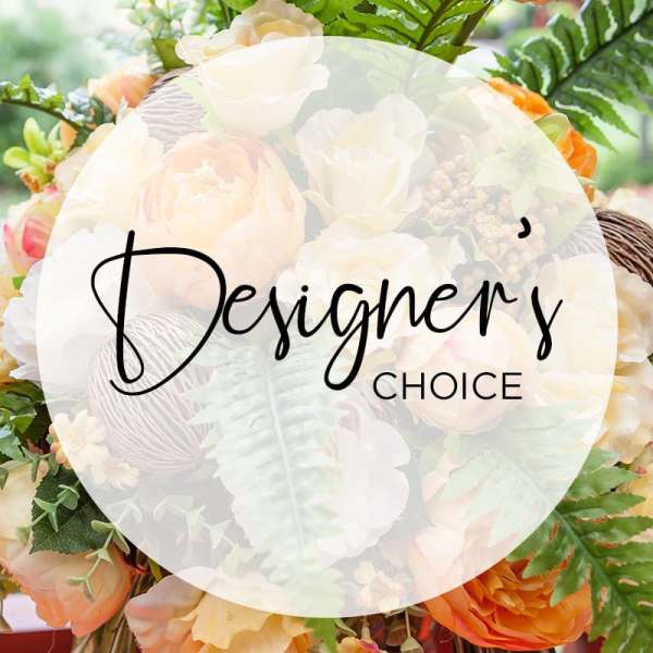 Mixed bouquet of peach, cream, and orange flowers with greenery