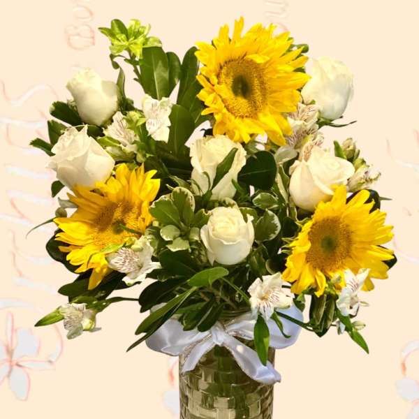 Bouquet of sunflowers and white roses in a glass vase