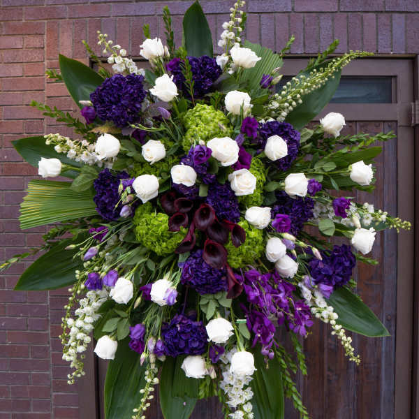 Large standing floral spray with white and purple flowers