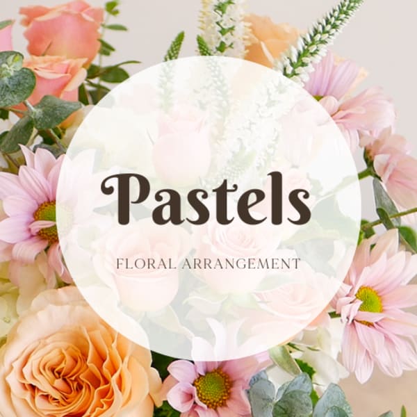 Pastel floral arrangement with pink daisies and peach roses