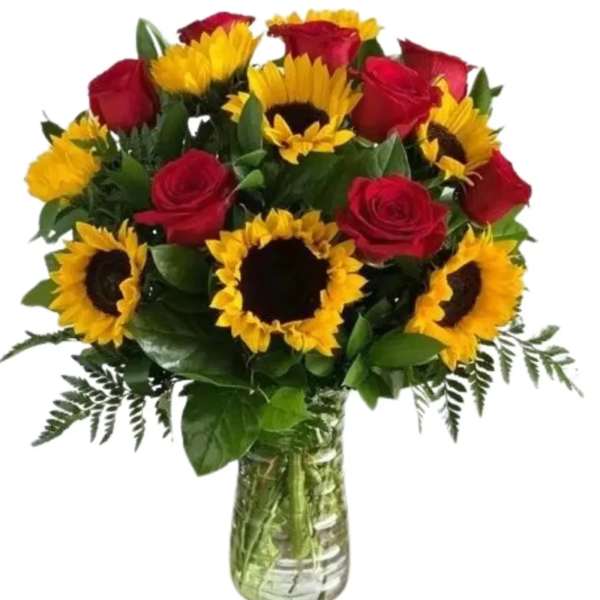Bouquet of red roses and yellow sunflowers in a glass vase