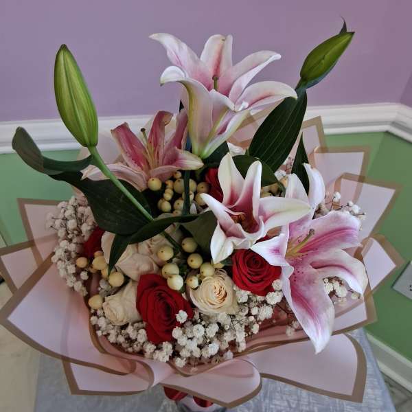One dozen Red and White Roses with Lilys bouquet