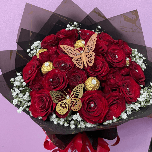 Two dozen classic fully decorated red roses