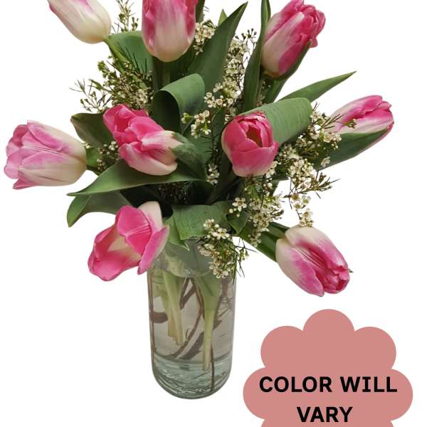 Pink tulips arranged in a clear glass vase