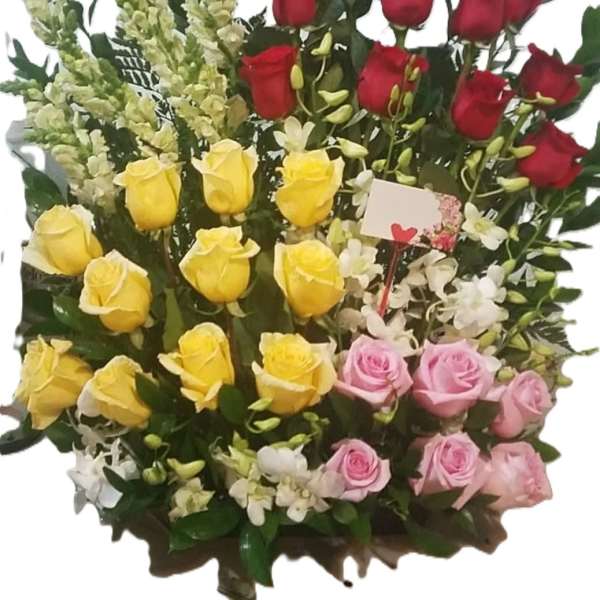 Two dozen plus red, pink, yellow arrangement with snap dragons and orchids
