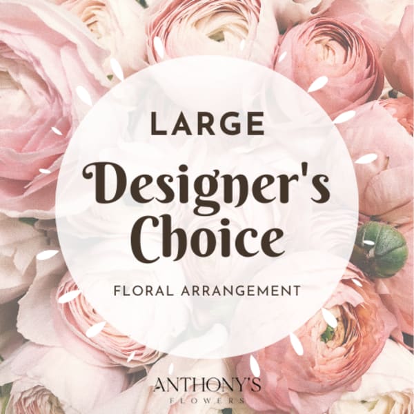Pink ranunculus bouquet with a designer's choice label