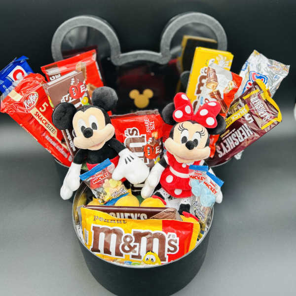 Mickey and Minnie plush toys in a black gift box with assorted candy