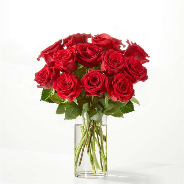 Bouquet of red roses in a clear glass vase