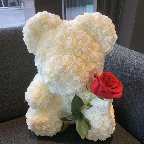White rose teddy bear with a red rose accent