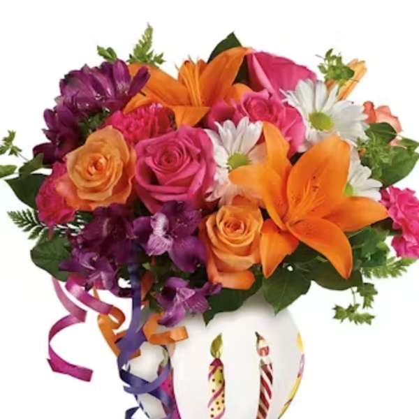 Bouquet of orange, pink, purple, and white flowers in a white vase