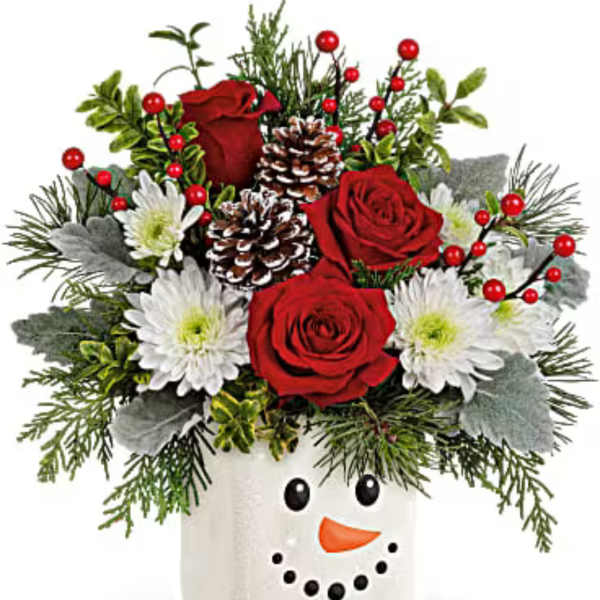 Holiday bouquet in a snowman vase with red roses and white daisies