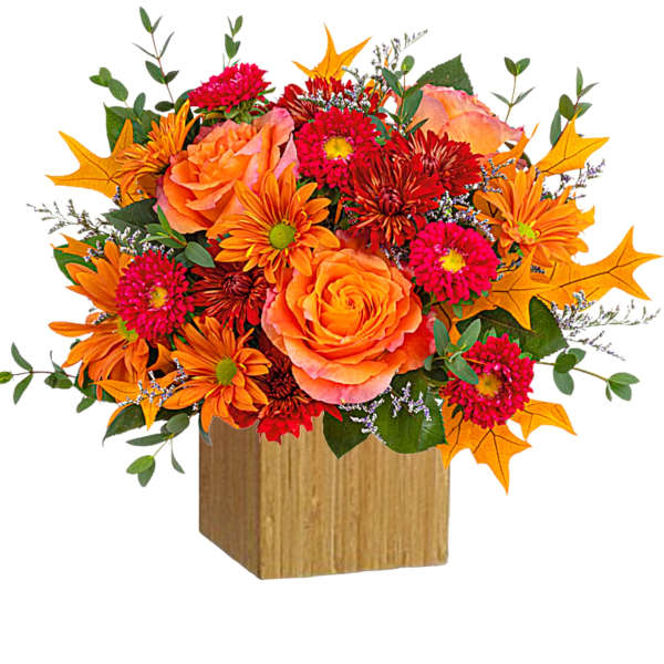 Orange and pink floral arrangement in a wooden cube vase