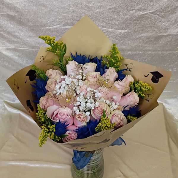 Two dozen pink roses for graduation style blue bouquet