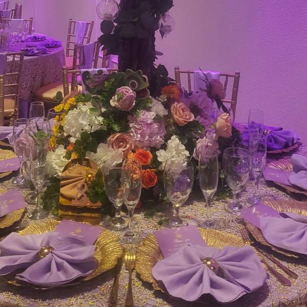 Elegant purple mix table center arrangement for special events