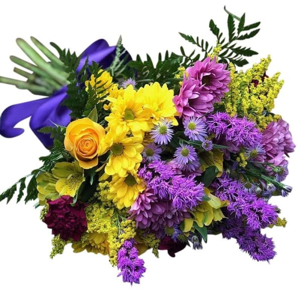 Mixed bouquet of yellow, purple, and pink flowers with a purple ribbon