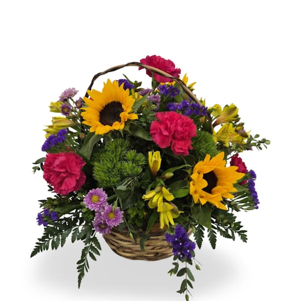 Basket arrangement with sunflowers, pink carnations, and purple flowers