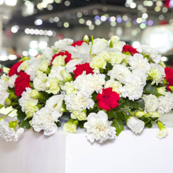 White and red floral arrangement on a table