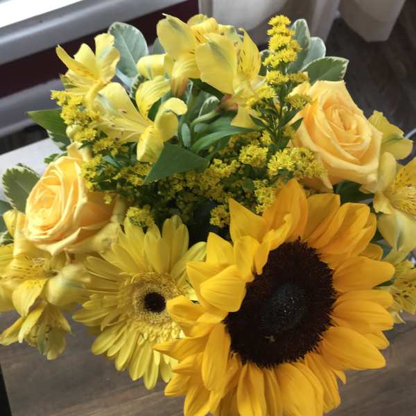 Yellow bouquet with sunflowers, roses, and alstroemeria