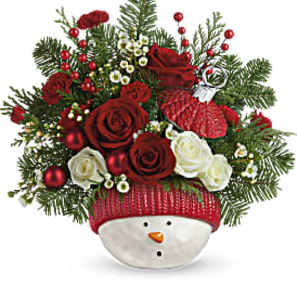 Christmas bouquet in a snowman container with red and white roses