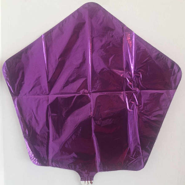 Purple metallic star-shaped foil balloon on a white background