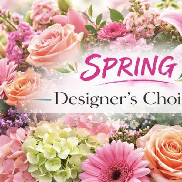 Spring floral arrangement with pink and peach flowers and a lily