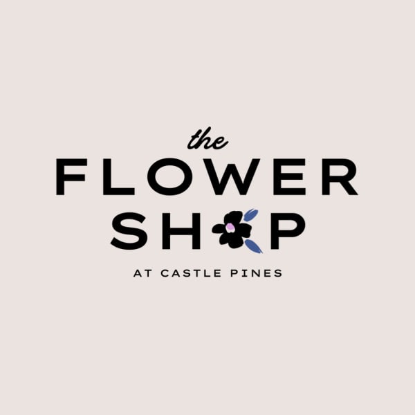 Minimal logo reading The Flower Shop at Castle Pines with a small stylized flower icon.