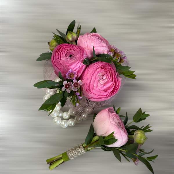 Pink ranunculus bouquet with pearl accents and greenery