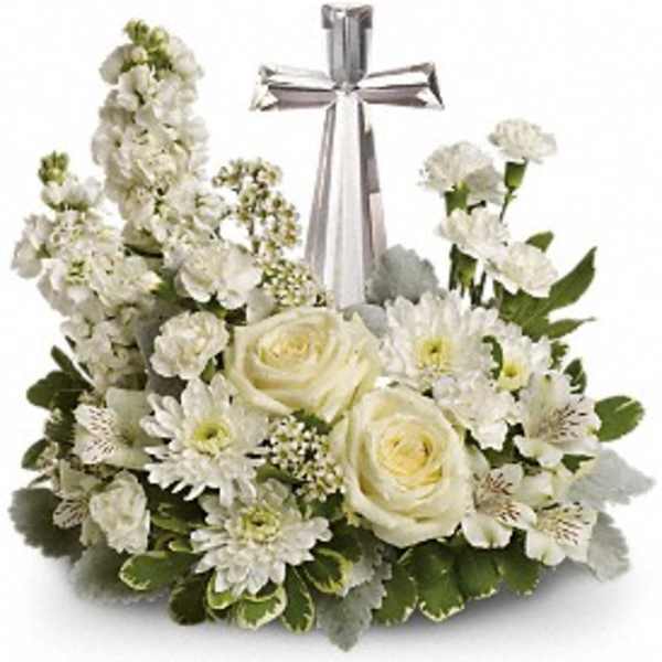 White floral arrangement with a silver cross centerpiece