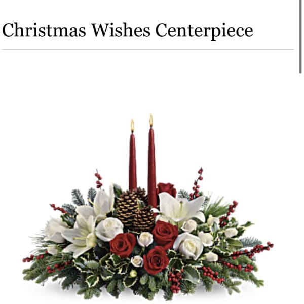 Christmas centerpiece with red candles, white lilies, and red roses