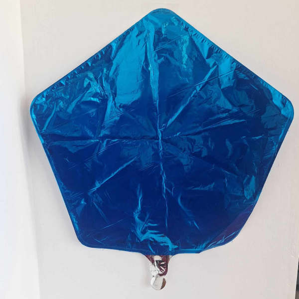 Blue star-shaped foil balloon on a white wall