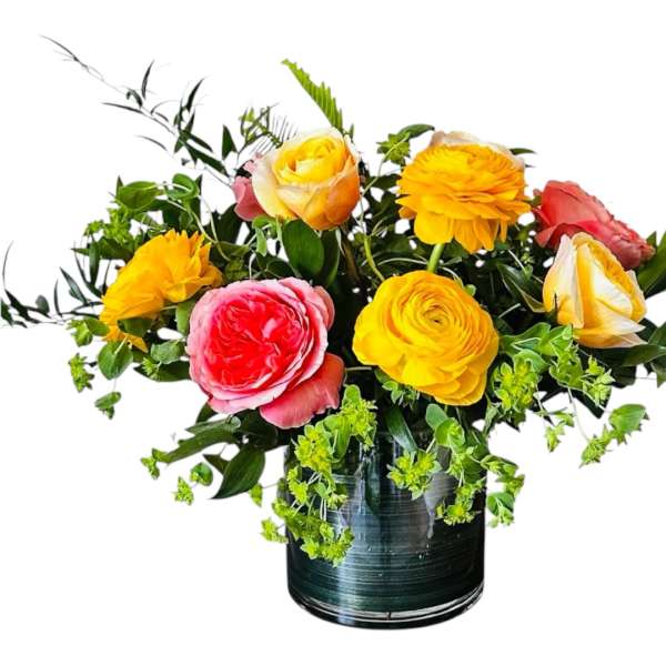 Mixed bouquet of bright roses in a dark glass vase