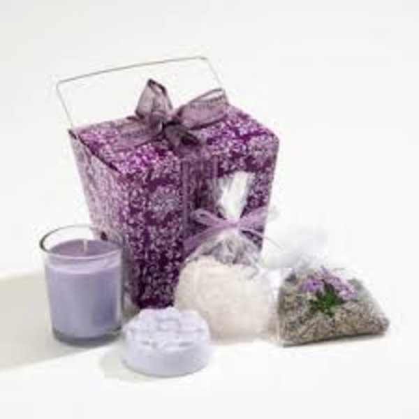 Purple floral gift box with lavender candle, soaps, and scented sachet bags