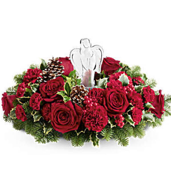 Red rose and carnation centerpiece with a white angel topper
