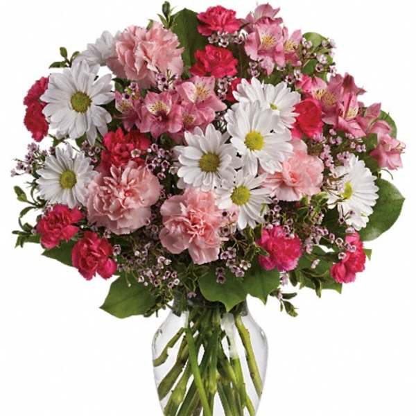 Pink and white mixed bouquet in a clear glass vase