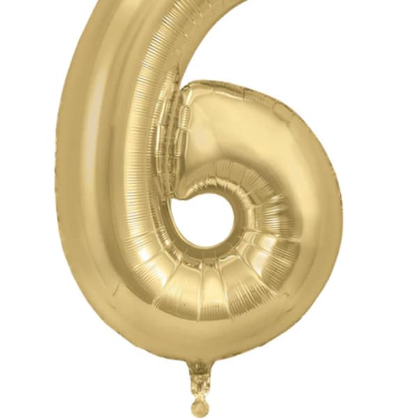 Gold foil balloon shaped like the number 6